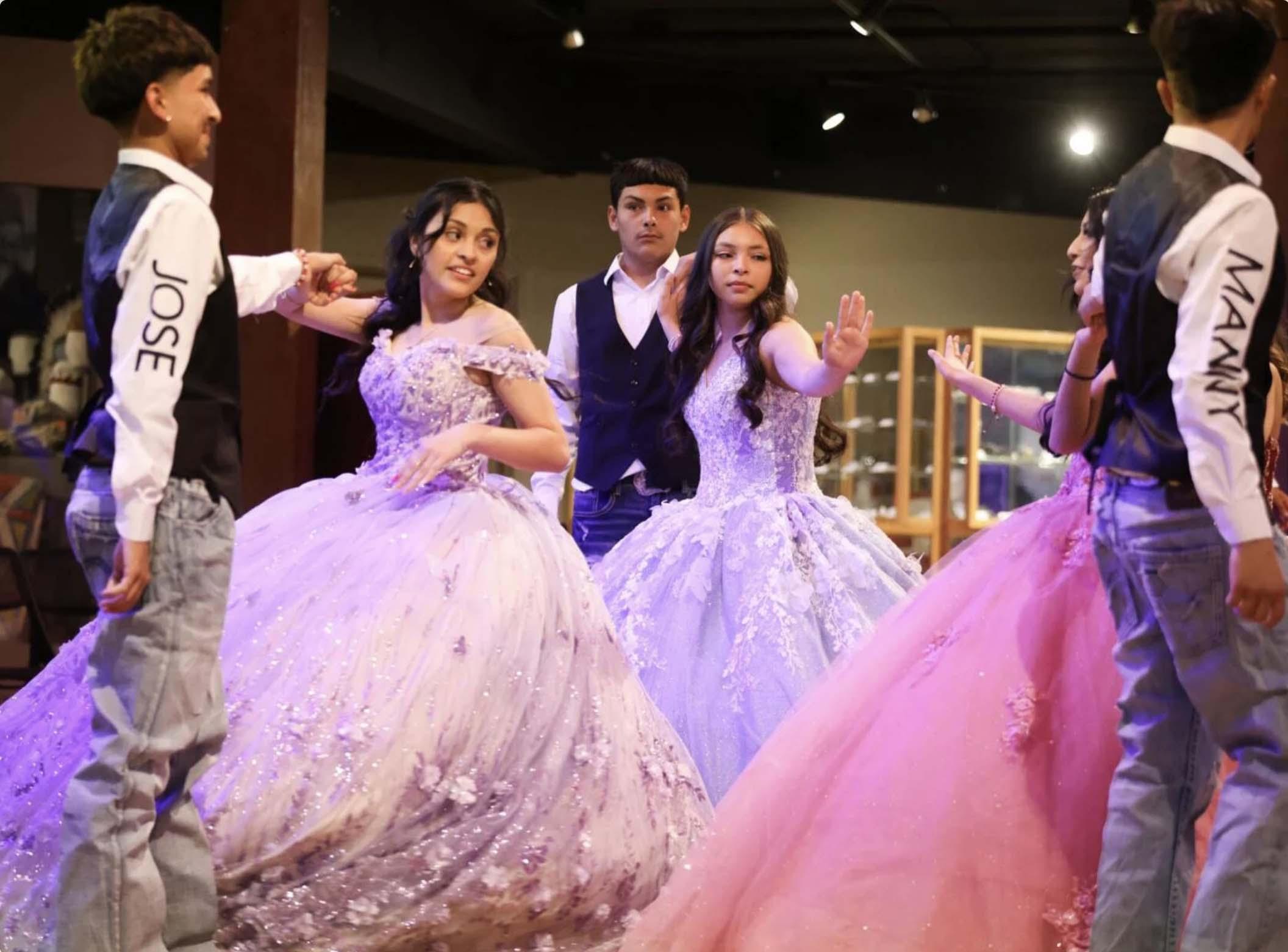 Girls and boys dancing at a quinceanera
